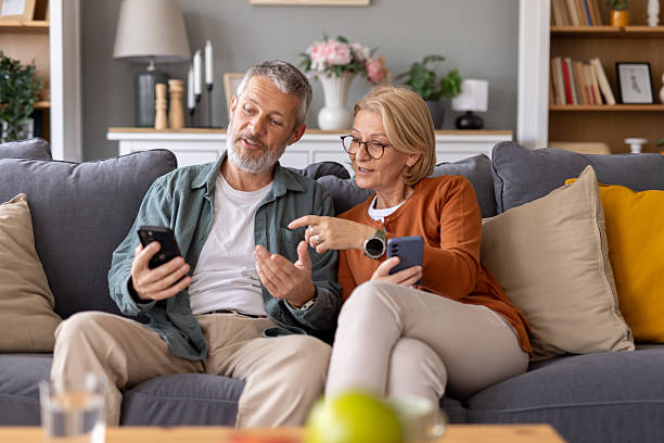 istock Couple Exploring Mobile Apps Together on a Cozy Sofa 2231297611