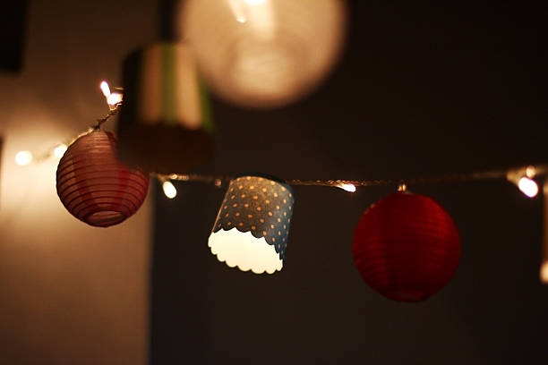 istock Ornamental string lights illuminating paper lanterns and cupcake liners 2231298600