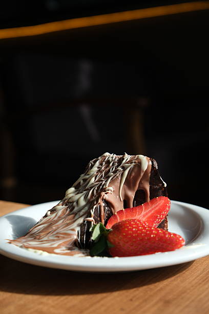 Chocolate cake slice with fresh strawberry