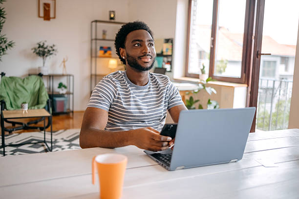 istock Contactless payment using laptop and mobile phone at home 2231300310