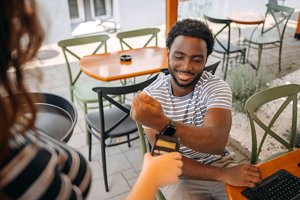 istock Contactless payment using smart watch at cafe 2231301144