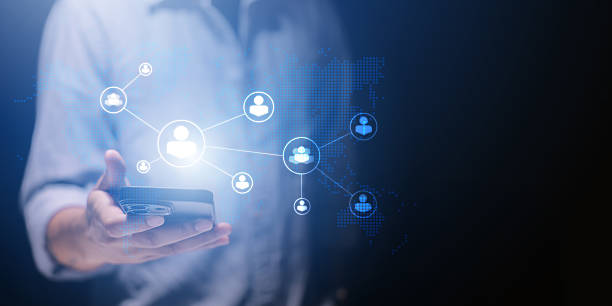 istock A man is using a smartphone and tablet to social network connection and communication people icon. Human connection, social network, global business and communication technology background design. 2231302594