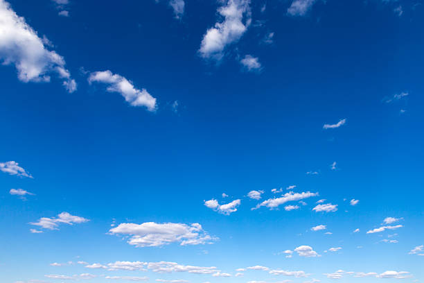 istock Blue sky background with tiny clouds. fluffy clouds in the sky. Background summer sky 2231304338