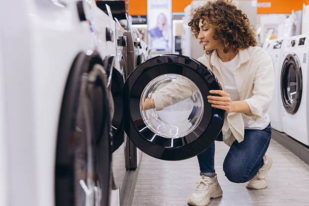 istock Woman Choosing Washing Machine in Appliance Store 2231306761