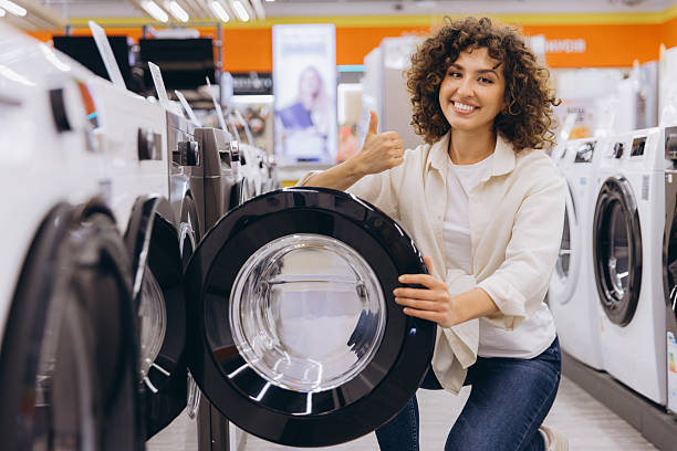 istock Woman Choosing Washing Machine in Electronics Store 2231306763