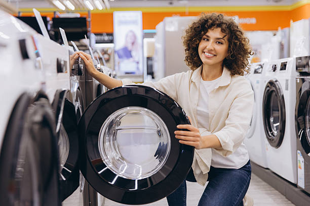 istock Woman Choosing Washing Machine in Appliance Store 2231306780
