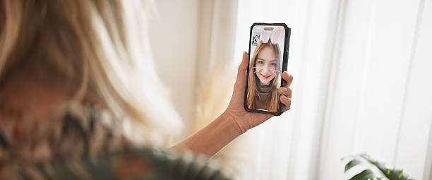 istock Woman use smartphone for video call, talking and smiling at home. Leisure activity, internet technology, social network concept 2231306807