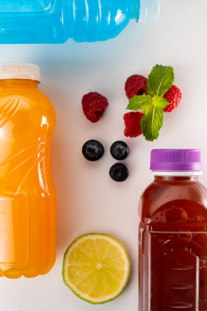 istock Isotonic drinks, fruit juice and fresh fruit lying on a white background, representing a healthy and refreshing lifestyle 2231308352