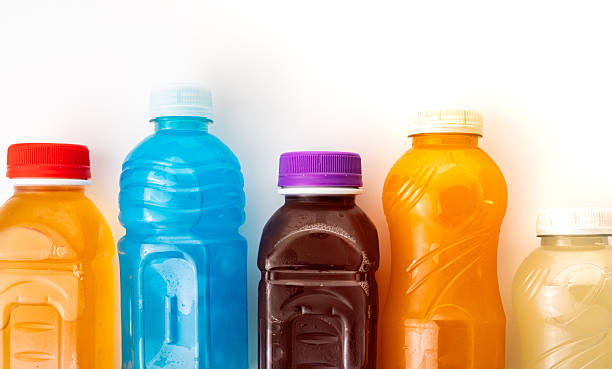 istock Isotonic drinks of different colors and flavors standing on a white background, promoting a healthy and refreshing lifestyle 2231308401