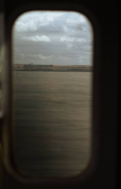 istock A view from a window, showing the vast landscape below, with a blurred foreground to create a sense of motion. 2231309836