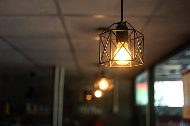 istock Classing ceiling lighting lamp with metal cage that glowing in warmlight shade. 2231312879