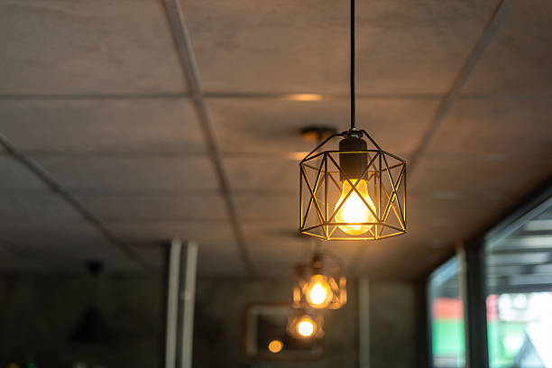 istock Classing ceiling lighting lamp with metal cage that glowing in warmlight shade. 2231312961