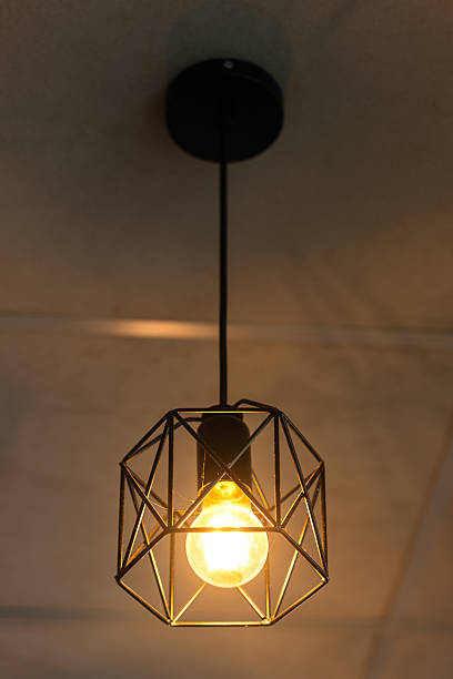 istock Classing ceiling lighting lamp with metal cage that glowing in warmlight shade. 2231312998