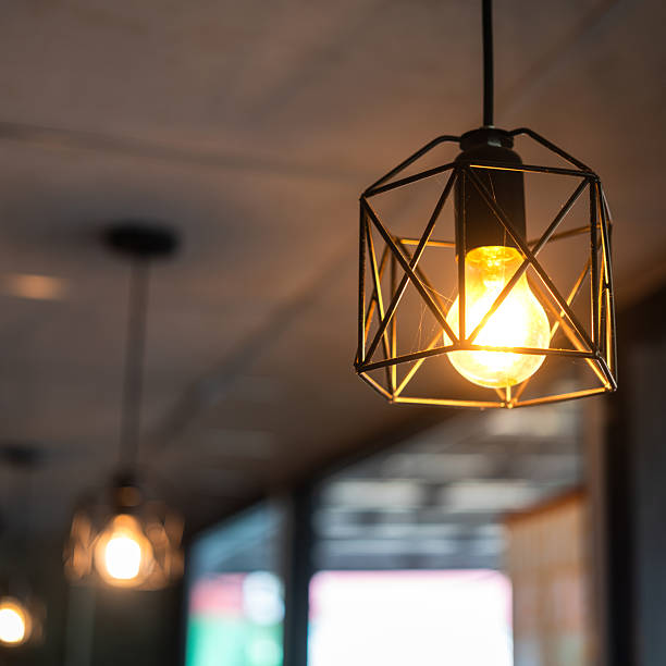 istock Classing ceiling lighting lamp with metal cage that glowing in warmlight shade. 2231313043
