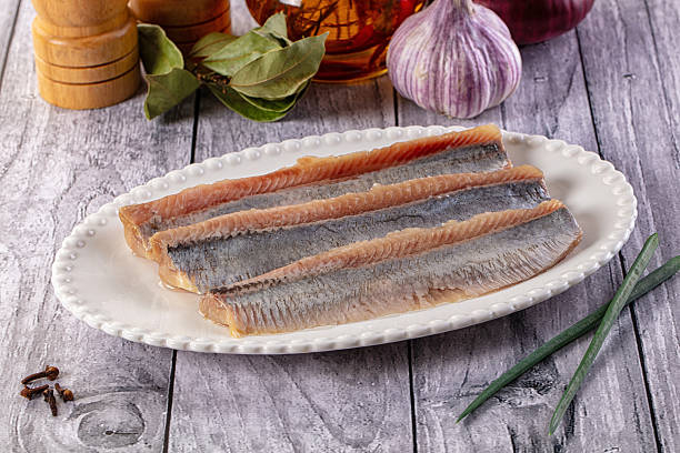 istock Marinated salted herring fillet slices 2231313786