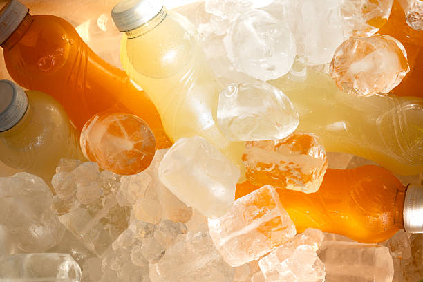 istock Chilled plastic bottles holding citrus juice nestled on ice, offering cold refreshment during hot summer moments 2231314104