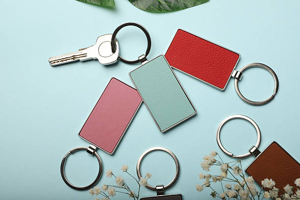 istock Metal and leather keychains. Colorful one side leather; Square, rectangle and circle shaped key rings. Concept shots, 2231315138