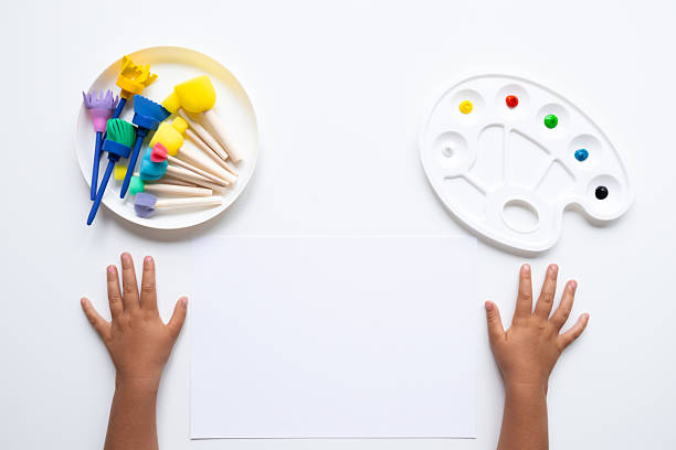 istock Child art supplies with paint and brushes ready for creative activity 2231316515