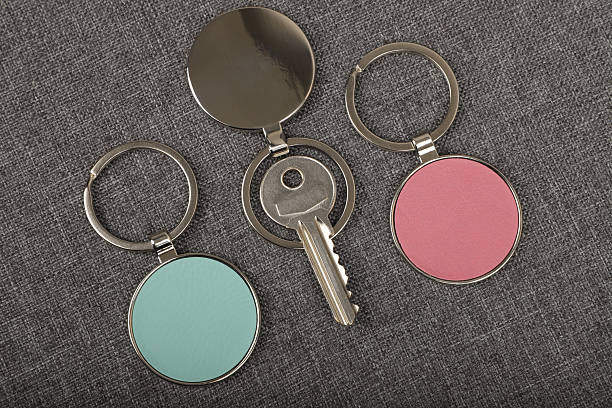 istock Metal and leather keychains. Colorful one side leather; Square, rectangle and circle shaped key rings. Concept shots, 2231316682