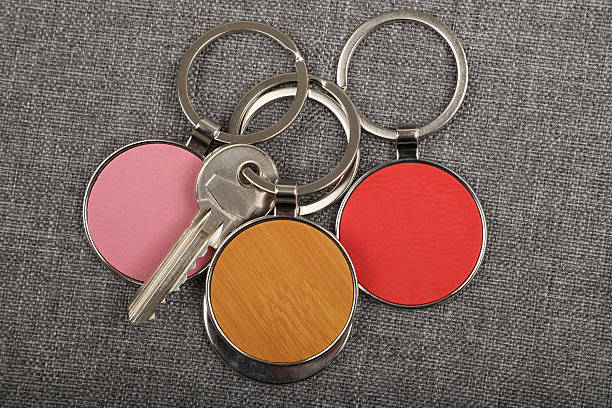 istock Metal and leather keychains. Colorful one side leather; Square, rectangle and circle shaped key rings. Concept shots, 2231316726