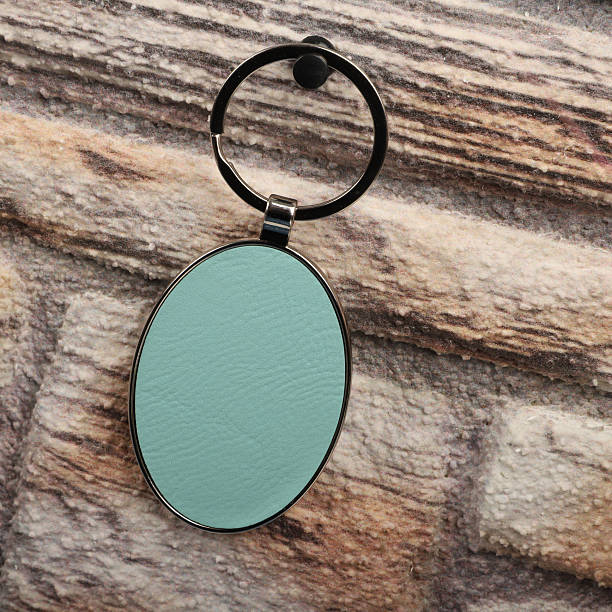 istock Metal and leather keychains. Colorful one side leather; Square, rectangle and circle shaped key rings. Concept shots, 2231317291