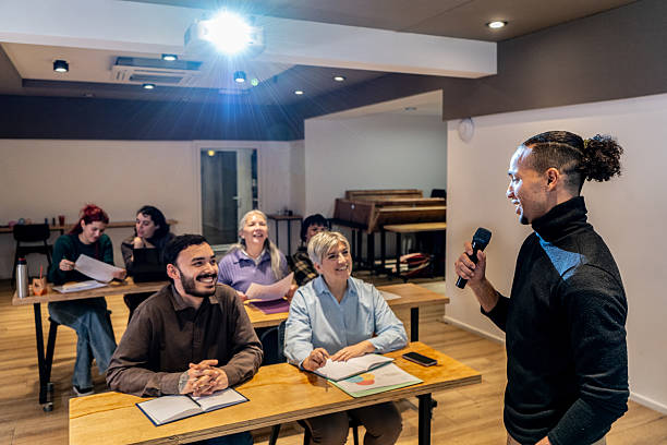 istock Mid adult businessman doing presentation during seminar at office 2231318209