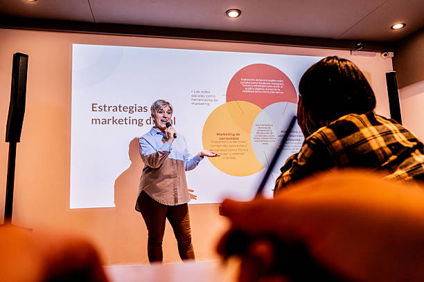 istock Mature businesswoman doing presentation at office 2231318254