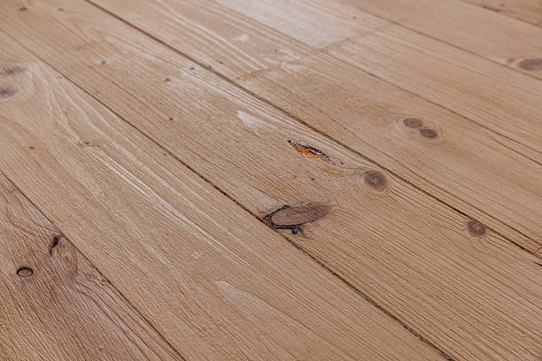 istock Close-up of freshly sanded spruce parquet flooring. 2231319735