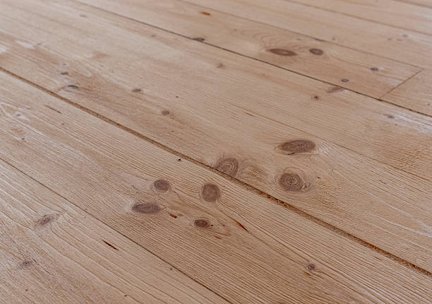 istock Close-up of freshly sanded spruce parquet flooring. 2231319753