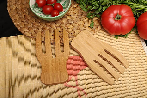 istock Wooden salad hands, Bamboo kitchen utensils, Concept shot. E-commerce photos. 2231320069