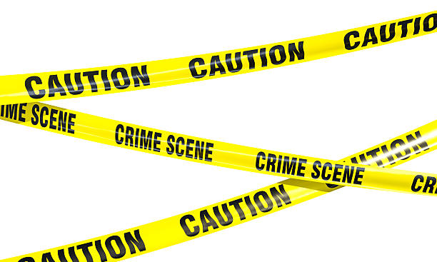 istock Crime scene tape isolating restricted area with caution sign 2231323634