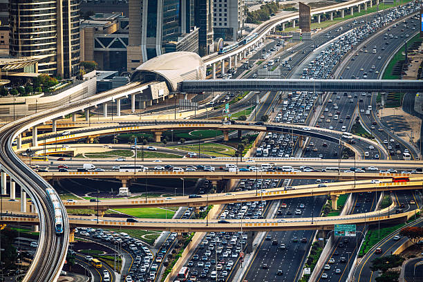 A captivating view of Dubai's modern highway network showcasing intricate traffic flow and urban skyline.Sheikh Zayed Road, Dubai, UAEv