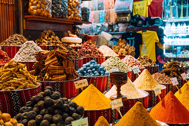 Vibrant Spice Market Display Featuring Piles of Exotic Flavors in Dubai stock photo
