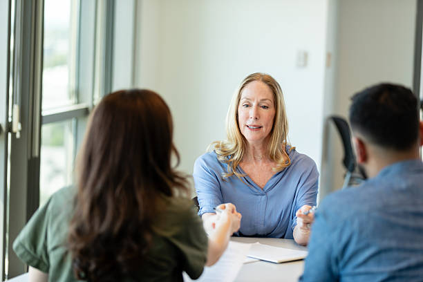istock Mature Woman Therapist in Group Therapy Session 2231325703