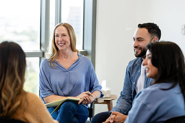 istock Group Therapy Session: Diverse Adults Discussing Mental Health 2231325768