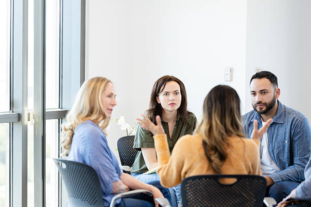 istock Group Therapy Session: Diverse Adults in Discussion 2231325773