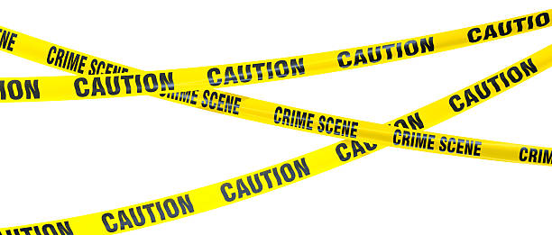 istock Yellow caution and crime scene tapes crossing on white background 2231326898
