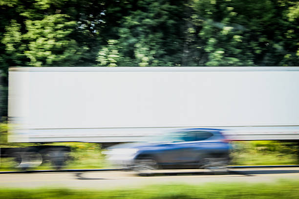transportation and travel abstract design element. moving vehicles, with a semi-trailer truck and a car on a road or highway,
