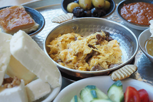 Traditional Breakfast Platter with Eggs, Cheese, Vegetables, and Bread Selection