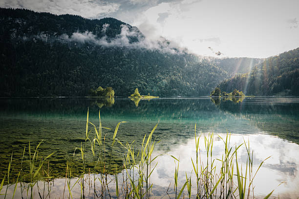 istock The sun breaks through the clouds at Lake Eibsee in the summer 2231339451