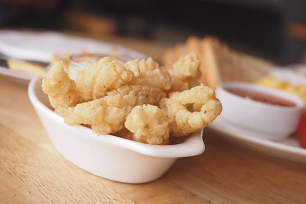 istock Crispy fried calamari served with dipping sauce at a casual eatery 2231342348