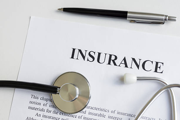 istock Insurance form with pen and stethoscope 2231345395