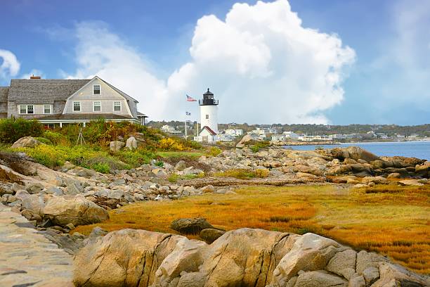 istock Lighthouse with Rocky Shore Line-Gloucester,Massachusetts 2231345454