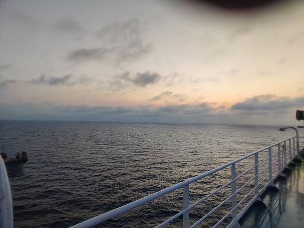 istock Passenger ferry traveling on calm ocean at sunset 2231345657