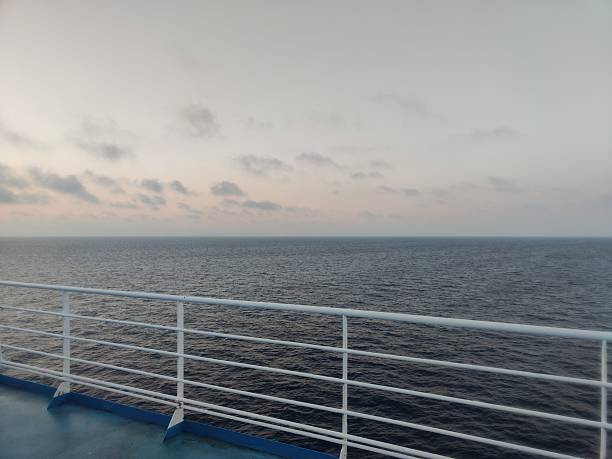 istock Calm sea and cloudy sky viewed from cruise ship deck 2231345661