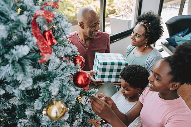 istock Family gathered at the Christmas tree 2231349126