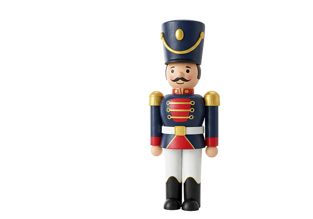Isolated Classic Wooden Nutcracker Figure in Blue and Red Uniform