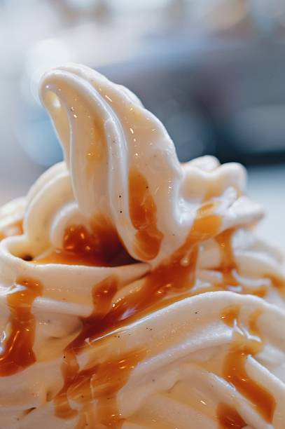 istock Soft serve vanilla ice cream drizzled with caramel syrup 2231352719
