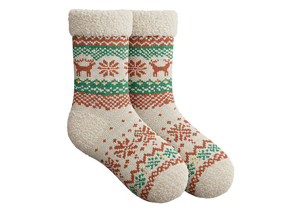 istock Isolated Christmas Socks with Reindeer and Snowflake Patterns 2231354594