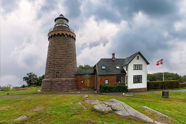 Hammeren Lighthouse rises like a fortress of the North , Danish endurance carved in granite and dramatic cloud. A coastal landmark where solitude feels right. Bornholm